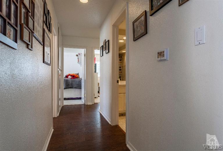 4724 Barnard Street Simi Valley, CA 93063 - Photo 12 of 30 a view of a hallway with wooden floor and closet