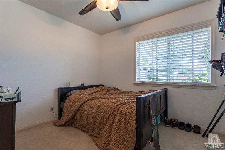 4724 Barnard Street Simi Valley, CA 93063 - Photo 14 of 30 a bed sitting in a bedroom next to a window