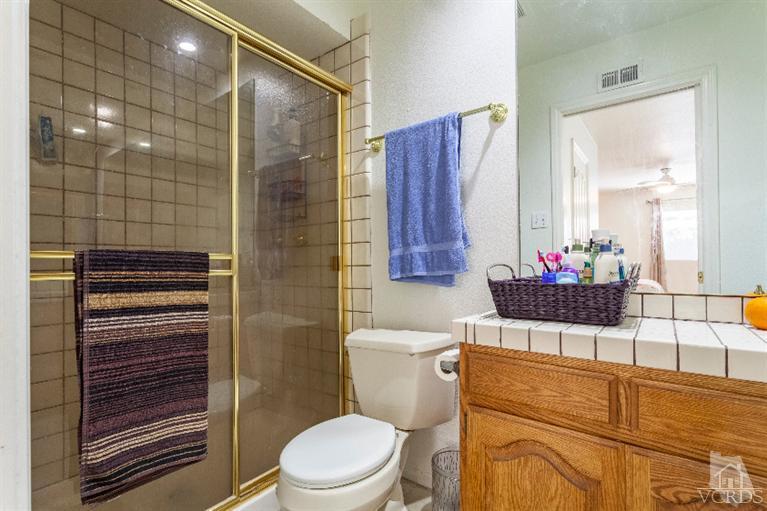 4724 Barnard Street Simi Valley, CA 93063 - Photo 20 of 30 a bathroom with a toilet and a shower