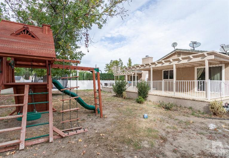 4724 Barnard Street Simi Valley, CA 93063 - Photo 27 of 30 a view of a house with a backyard