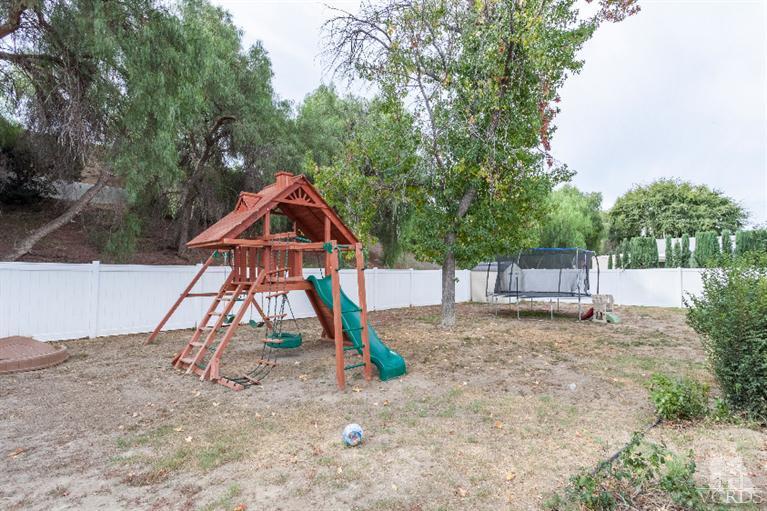 4724 Barnard Street Simi Valley, CA 93063 - Photo 28 of 30 a backyard of a house with table and chairs