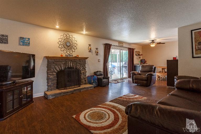 4724 Barnard Street Simi Valley, CA 93063 - Photo 4 of 30 a living room with furniture and a flat screen tv