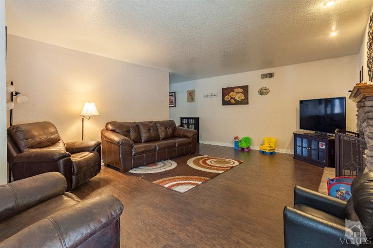 4724 Barnard Street Simi Valley, CA 93063 - Photo 5 of 30 a living room with furniture and a flat screen tv