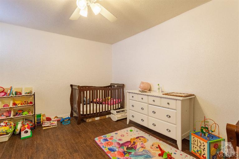 4724 Barnard Street Simi Valley, CA 93063 - Photo 10 of 30 a bed room with furniture and book shelf