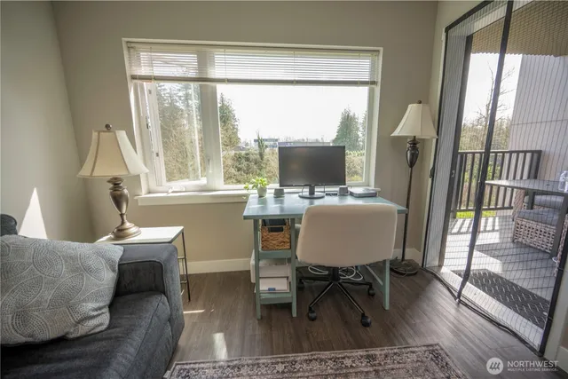 a workspace with furniture and a window