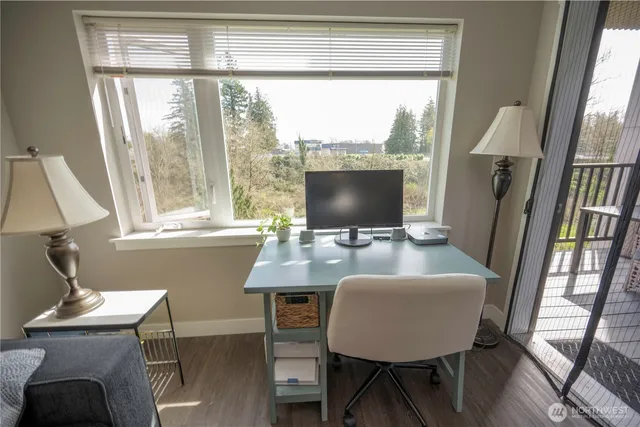a workspace with furniture and a window