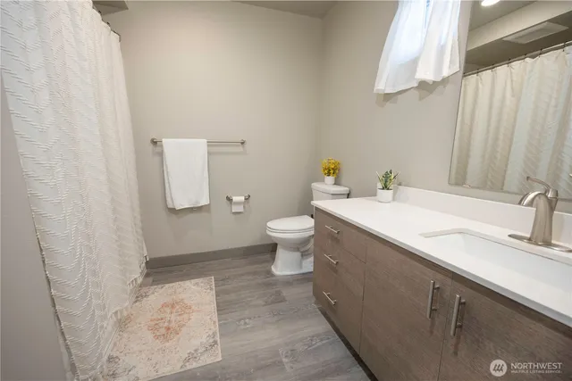 a bathroom with a sink and toilet