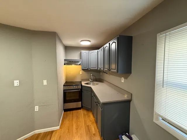 a kitchen with a sink and appliances