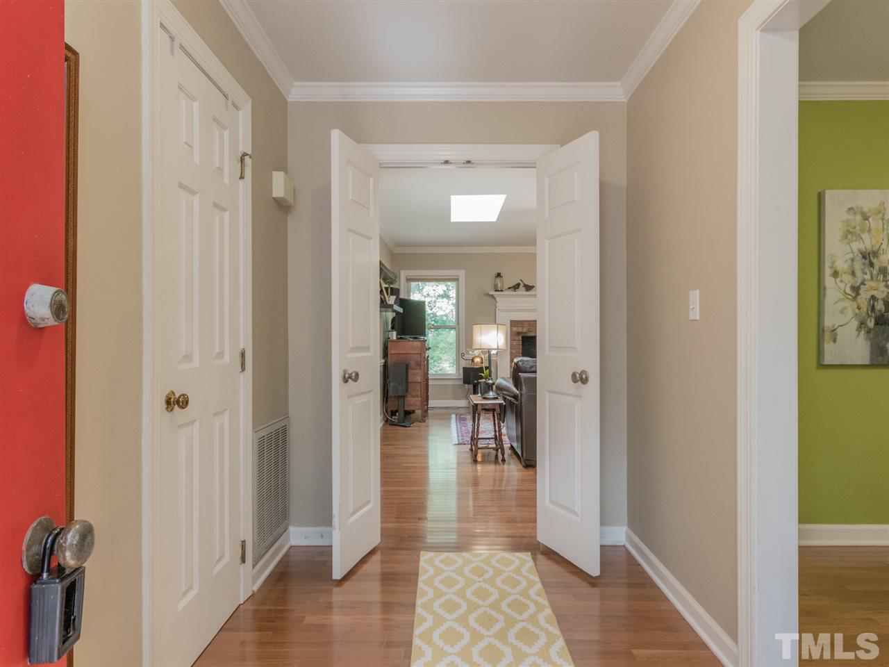 Greeted by gleaming hardwoods that extend through the home.