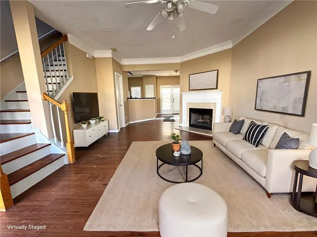 an empty room with windows and a fireplace