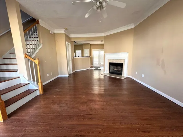 a living room with furniture fireplace and a flat screen tv