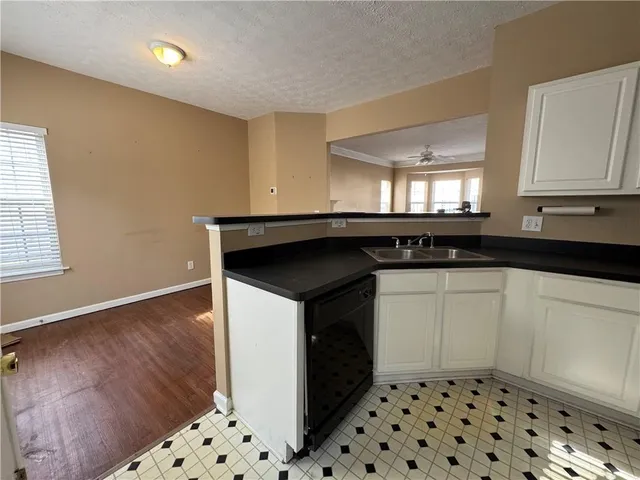 a white toilet sitting next to a bathroom sink