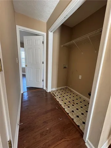 a bathroom with a granite countertop sink a toilet and a mirror