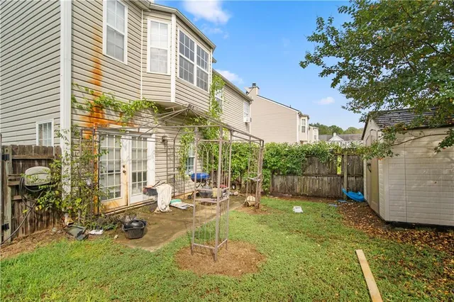 a view of backyard with a patio