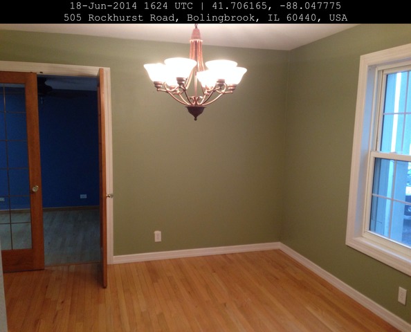 509 Rockhurst Road Bolingbrook, IL 60440 - Photo 4 of 14 a view of a chandelier in big room and chandelier fan