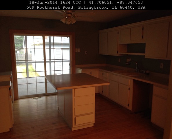 509 Rockhurst Road Bolingbrook, IL 60440 - Photo 9 of 14 a kitchen with stainless steel appliances wooden cabinets and a stove top oven