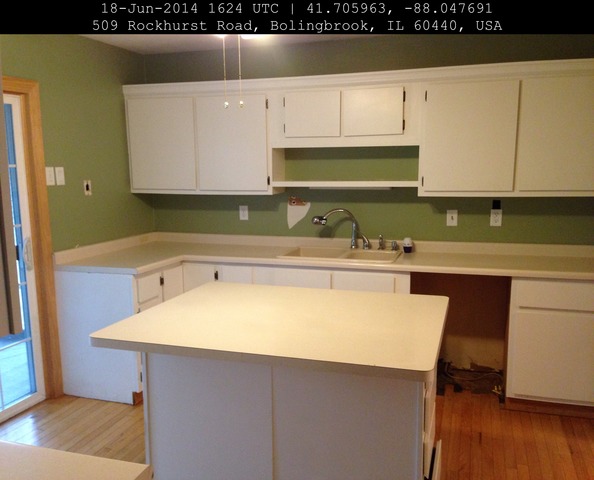 509 Rockhurst Road Bolingbrook, IL 60440 - Photo 10 of 14 a kitchen with a sink a stove and cabinets