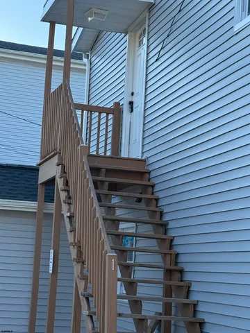 a view of entryway with wooden floor