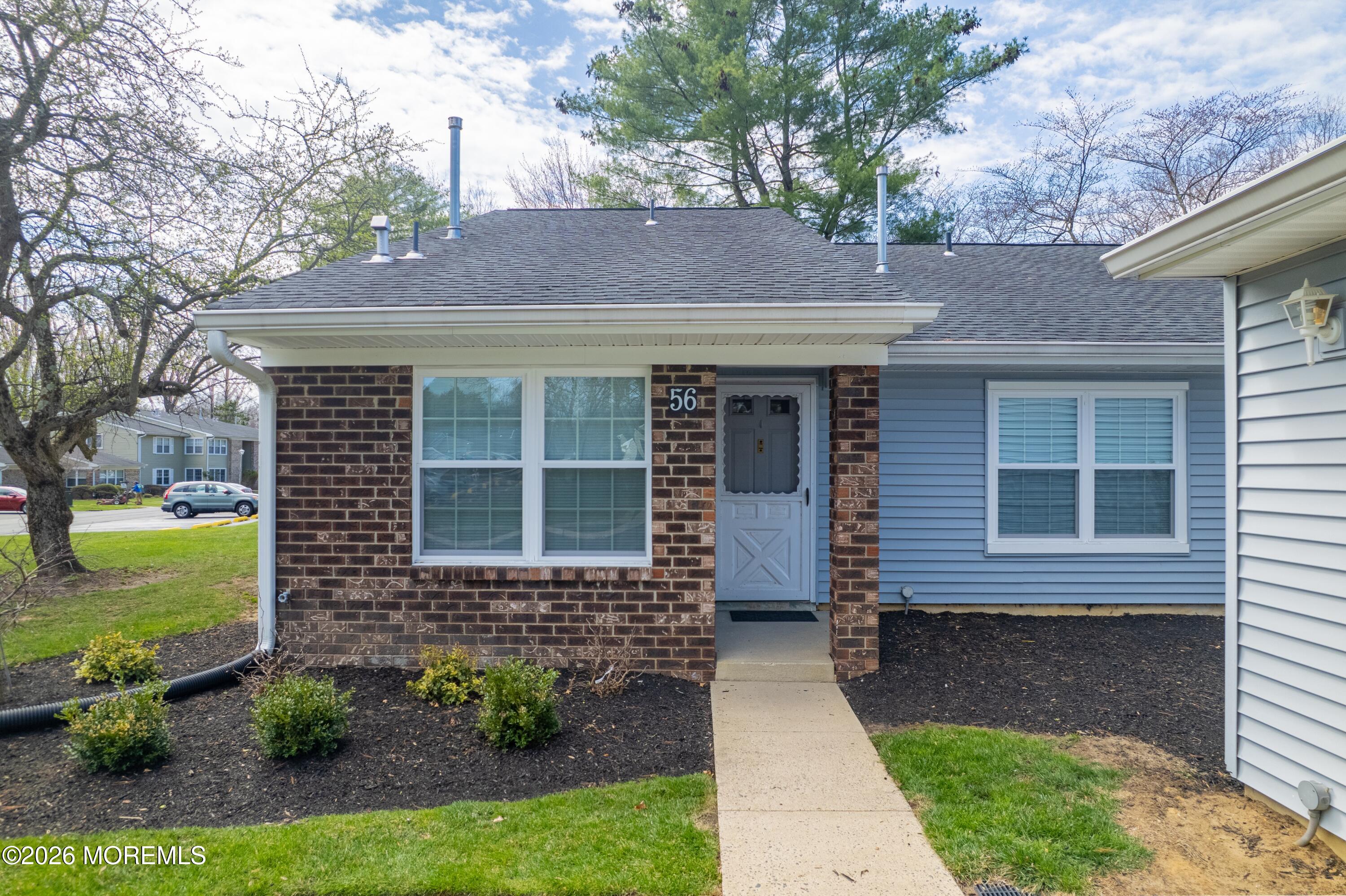 56 Privet Place Red Bank, NJ 07701 - Photo 1 of 19 a front view of a house with garden