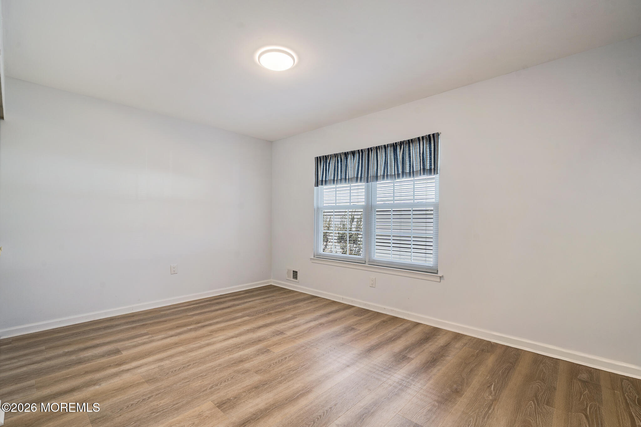 56 Privet Place Red Bank, NJ 07701 - Photo 11 of 19 wooden floor in an empty room with a window