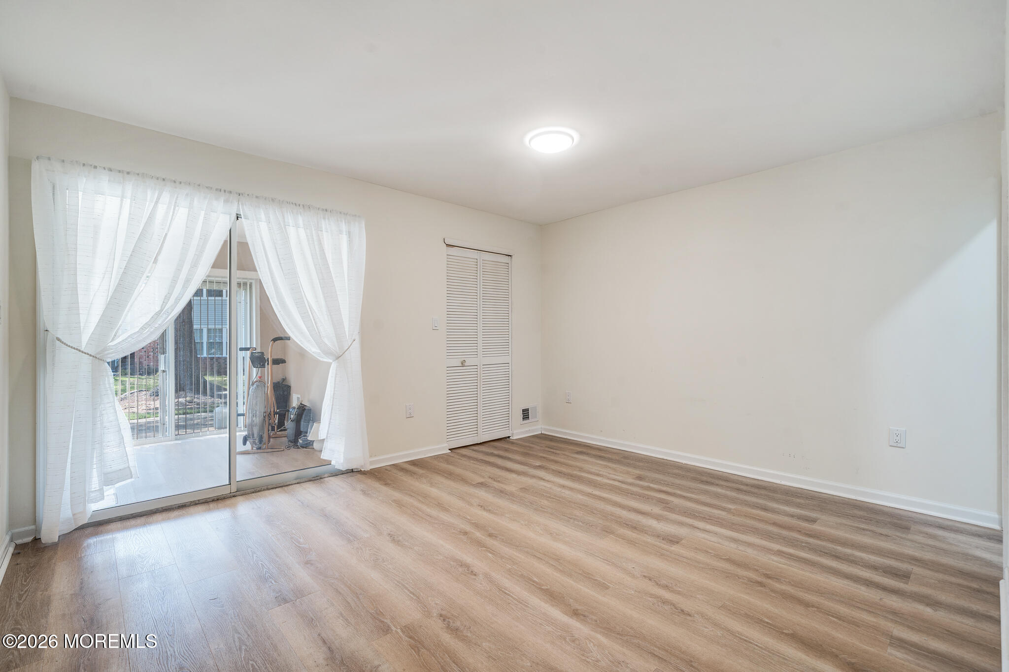 56 Privet Place Red Bank, NJ 07701 - Photo 13 of 19 wooden floor in an empty room with a window