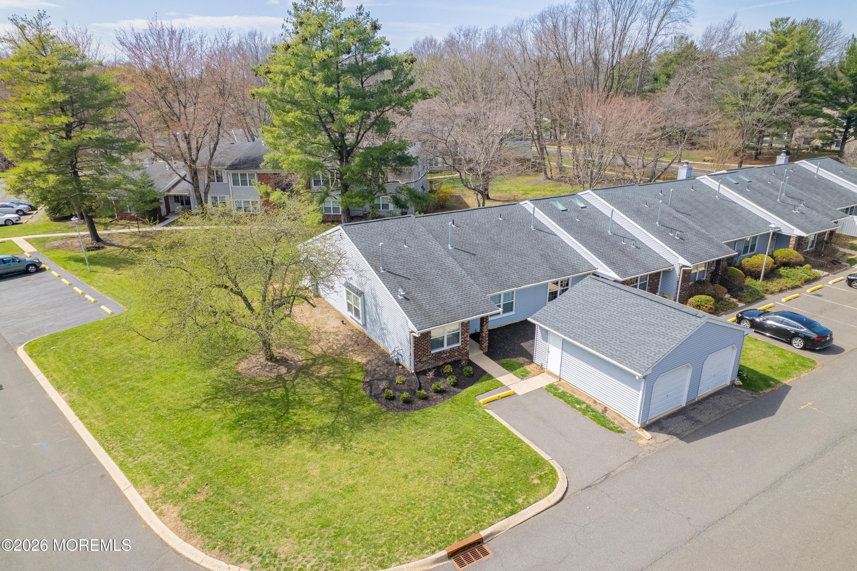 56 Privet Place Red Bank, NJ 07701 - Photo 2 of 19 an aerial view of a house with swimming pool and large trees