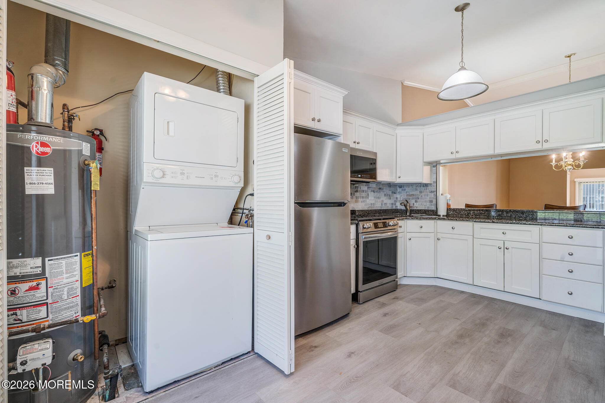 56 Privet Place Red Bank, NJ 07701 - Photo 5 of 19 a kitchen with refrigerator a stove and cabinets