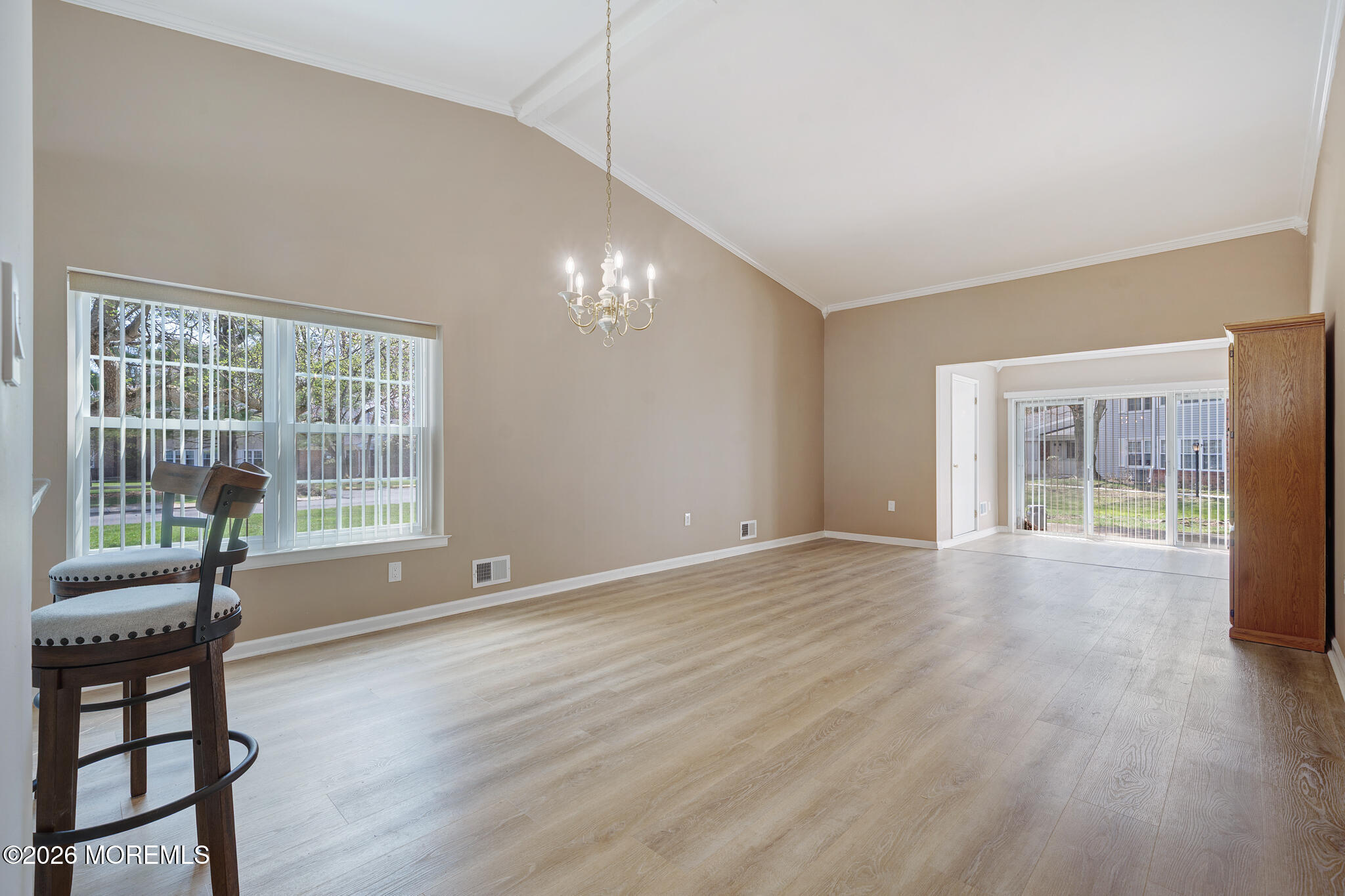 56 Privet Place Red Bank, NJ 07701 - Photo 7 of 19 a view of an empty room with wooden floor and a window