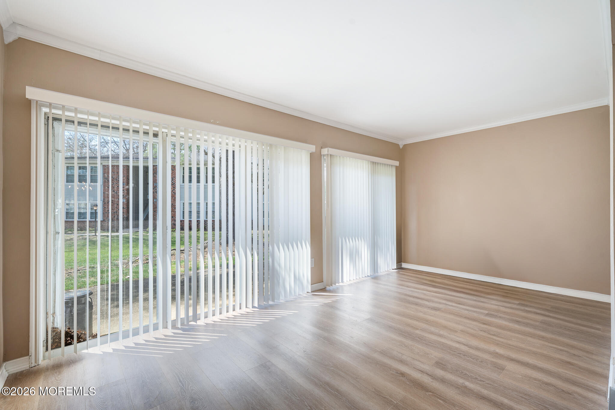 56 Privet Place Red Bank, NJ 07701 - Photo 9 of 19 an empty room with wooden floor and windows