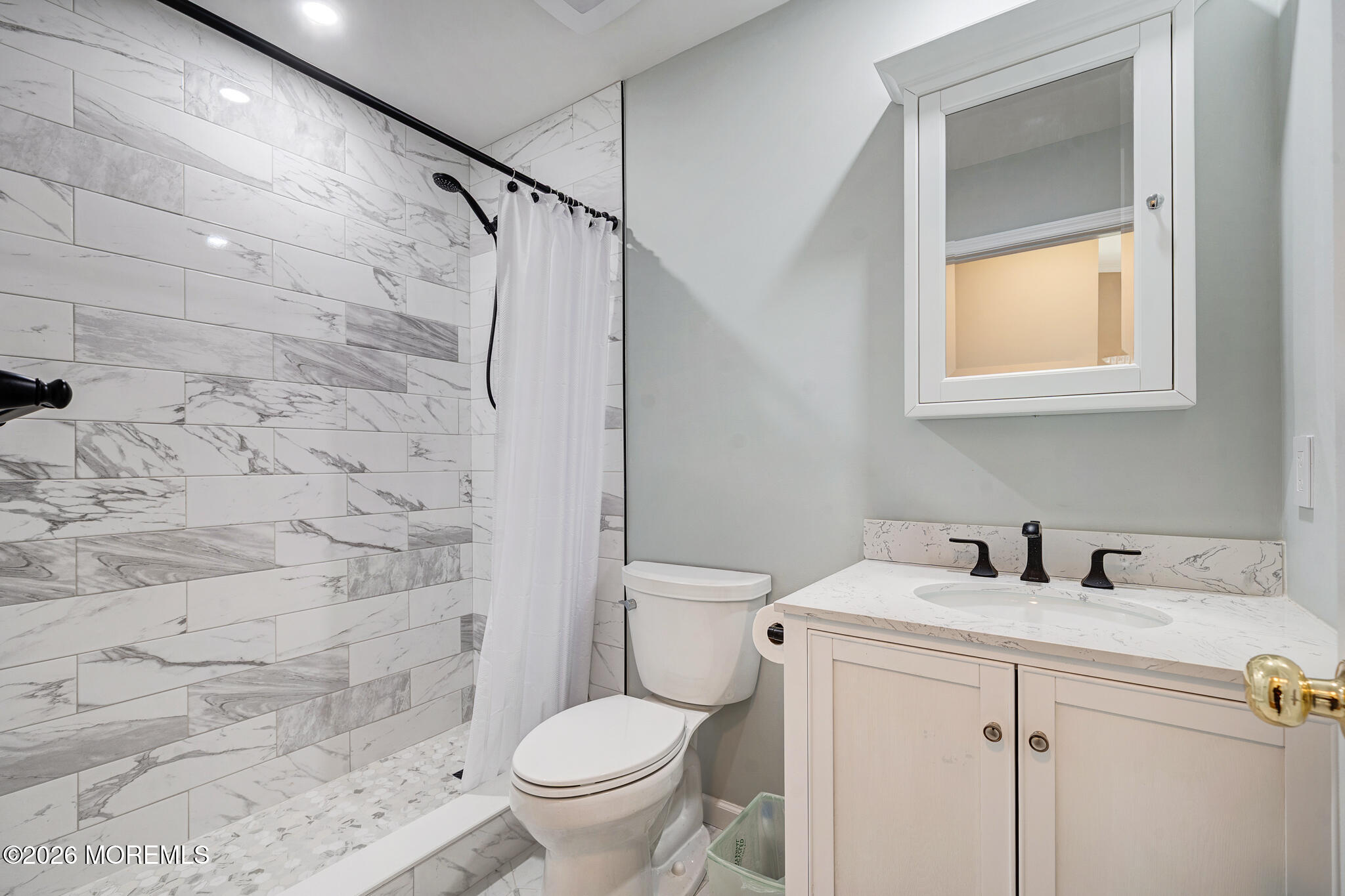 56 Privet Place Red Bank, NJ 07701 - Photo 10 of 19 a bathroom with a sink toilet and shower