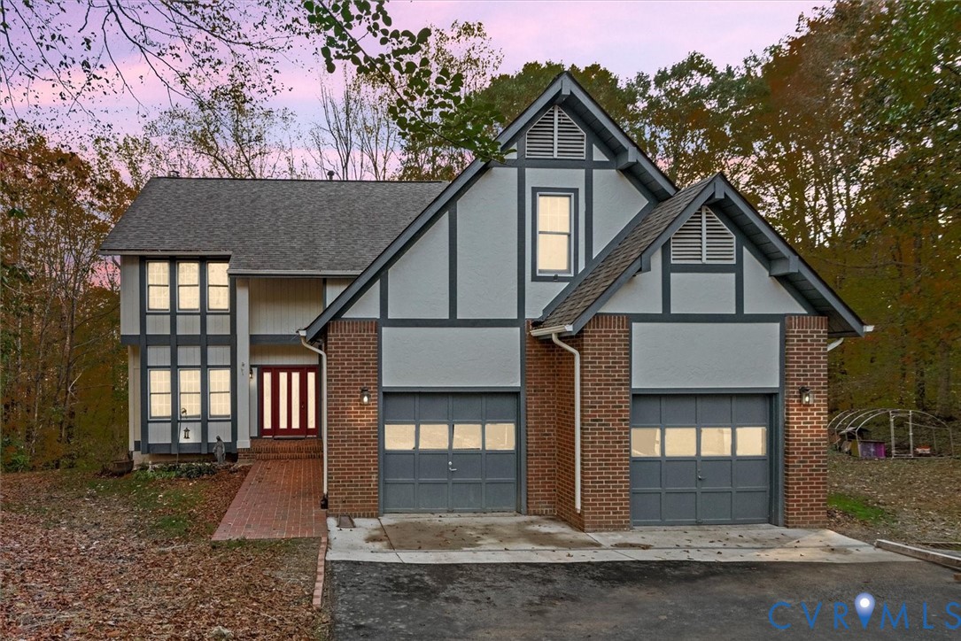 7358 Peppermill Road King George, VA 22485 - Photo 1 of 49 a front view of a house with a yard and garage