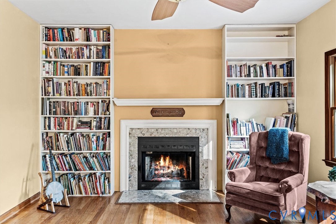 7358 Peppermill Road King George, VA 22485 - Photo 11 of 49 a living room with a bookshelf and a fireplace