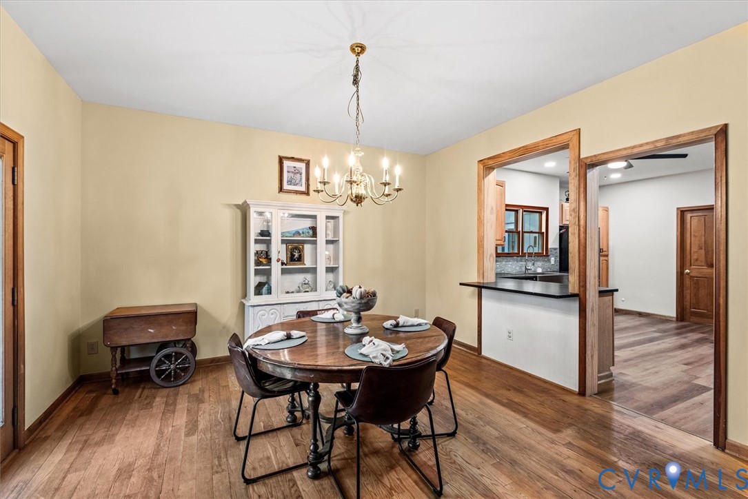 7358 Peppermill Road King George, VA 22485 - Photo 14 of 49 a view of a dining room with furniture window and wooden floor