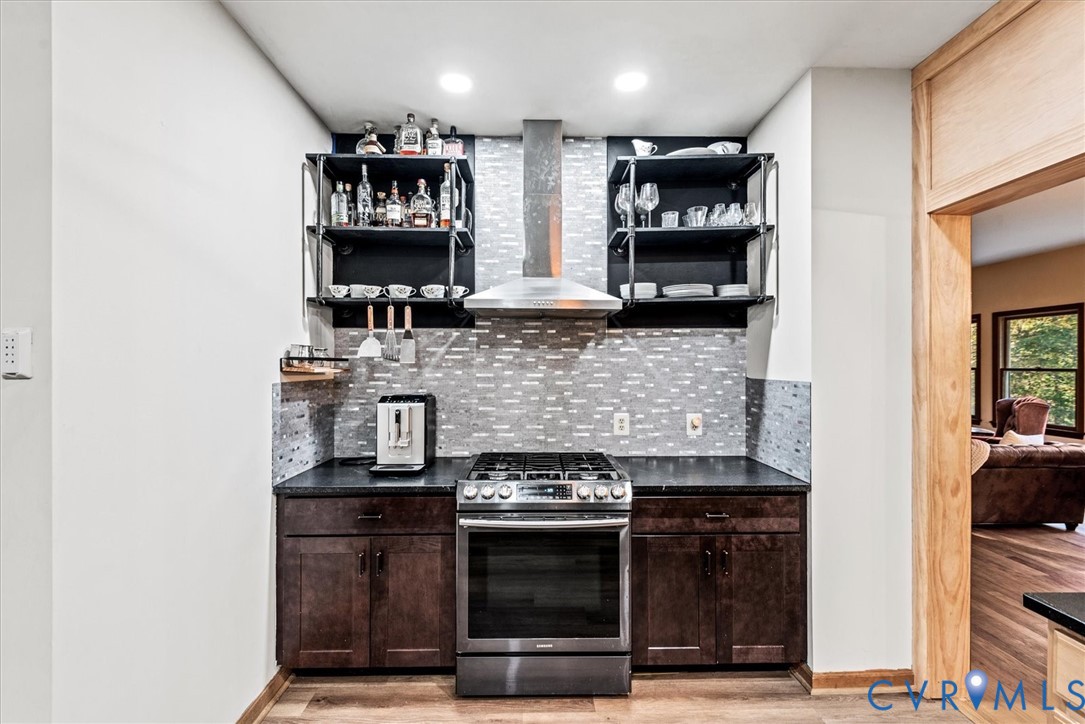7358 Peppermill Road King George, VA 22485 - Photo 16 of 49 a kitchen with stainless steel appliances granite countertop a stove and a refrigerator