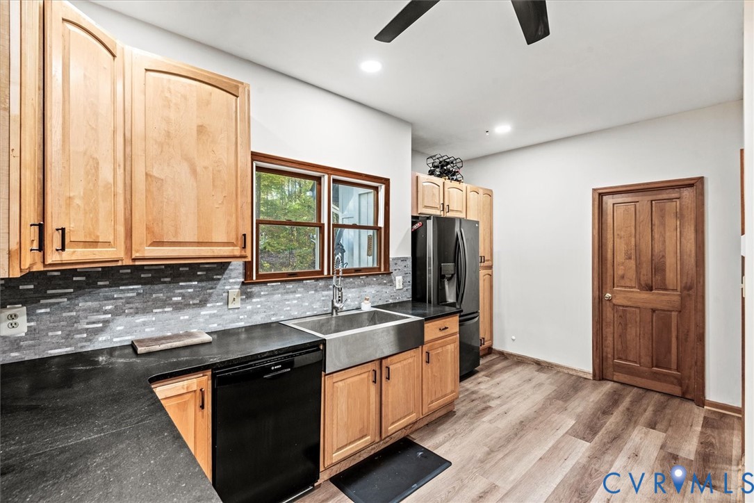 7358 Peppermill Road King George, VA 22485 - Photo 17 of 49 a kitchen with stainless steel appliances granite countertop a sink and a refrigerator