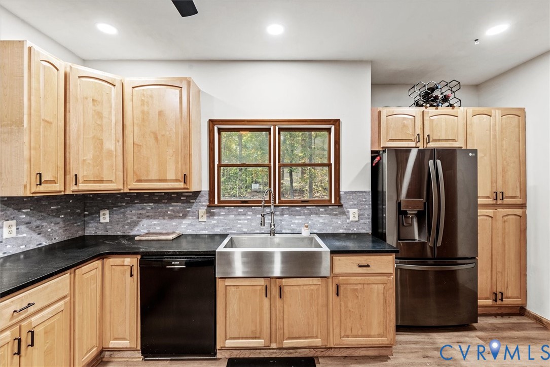 7358 Peppermill Road King George, VA 22485 - Photo 18 of 49 a kitchen with stainless steel appliances granite countertop a refrigerator and a sink