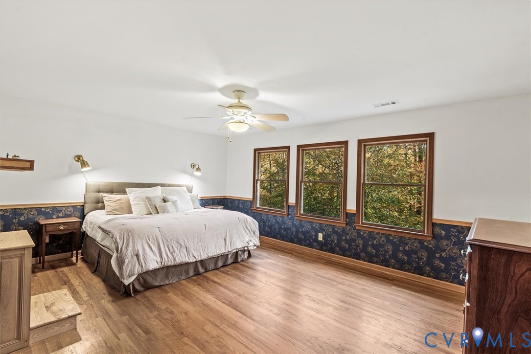 7358 Peppermill Road King George, VA 22485 - Photo 22 of 49 a spacious bedroom with a bed and a large window