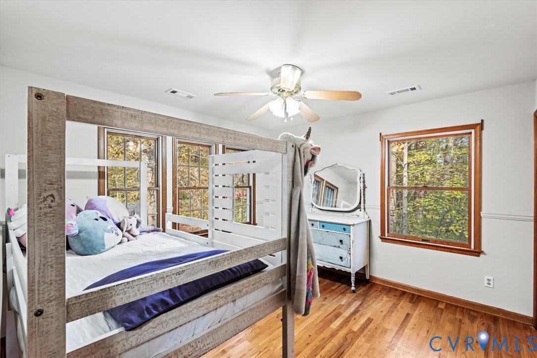 7358 Peppermill Road King George, VA 22485 - Photo 27 of 49 a bedroom with a bed and large windows