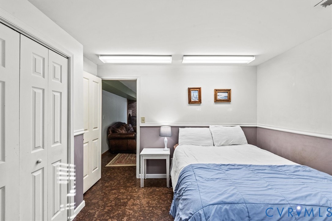 7358 Peppermill Road King George, VA 22485 - Photo 38 of 49 a bedroom with a bed and a painting on the wall