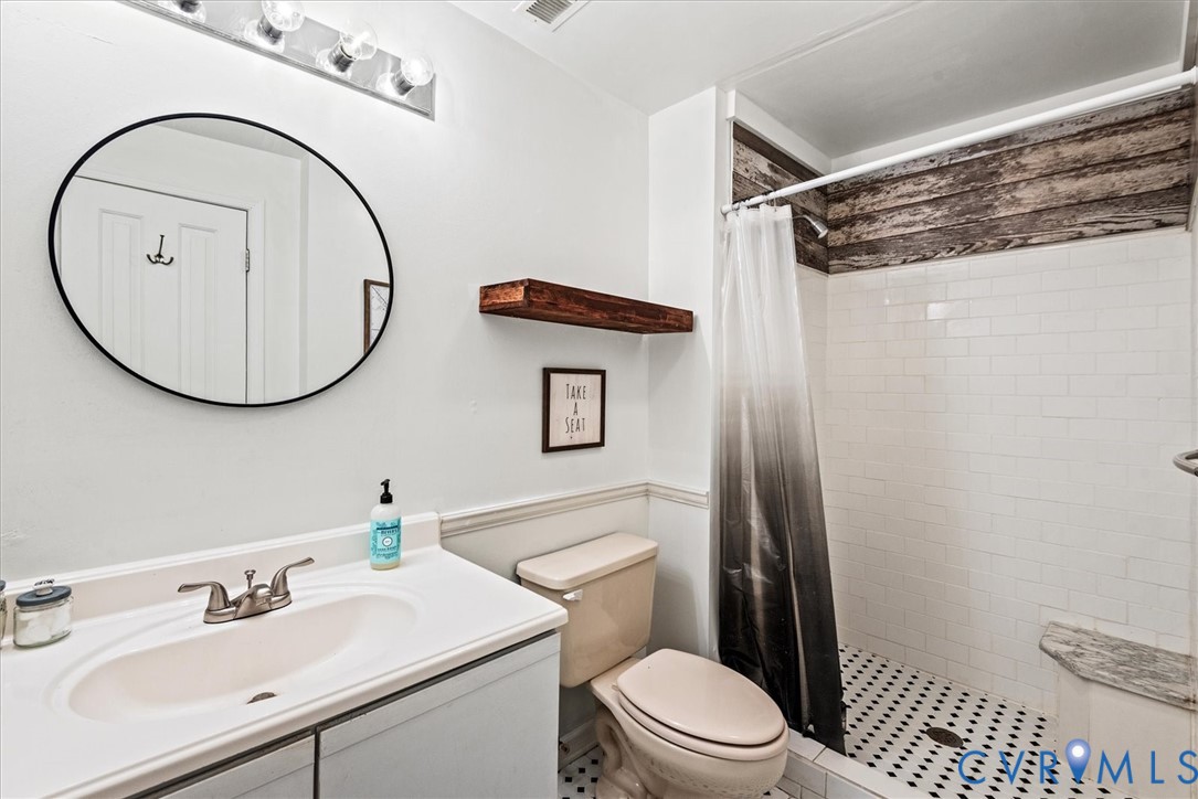 7358 Peppermill Road King George, VA 22485 - Photo 43 of 49 a bathroom with a sink mirror vanity and toilet