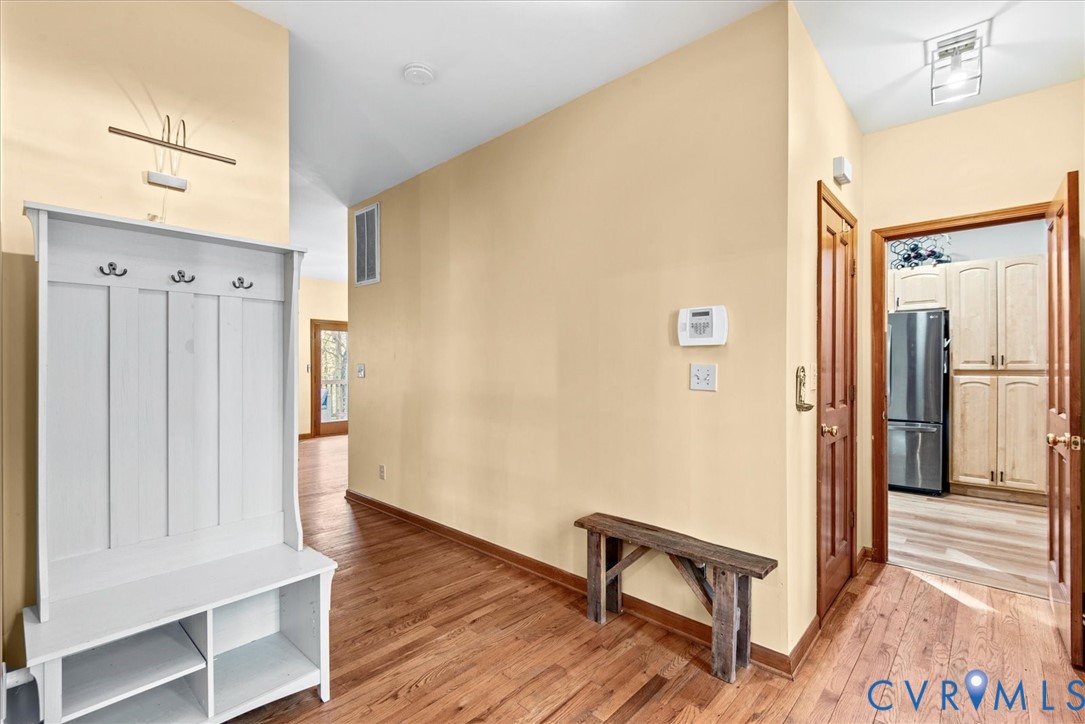 7358 Peppermill Road King George, VA 22485 - Photo 5 of 49 a view of a hallway with wooden floor and staircase