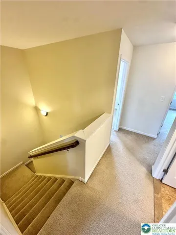 a view of hallway with stairs