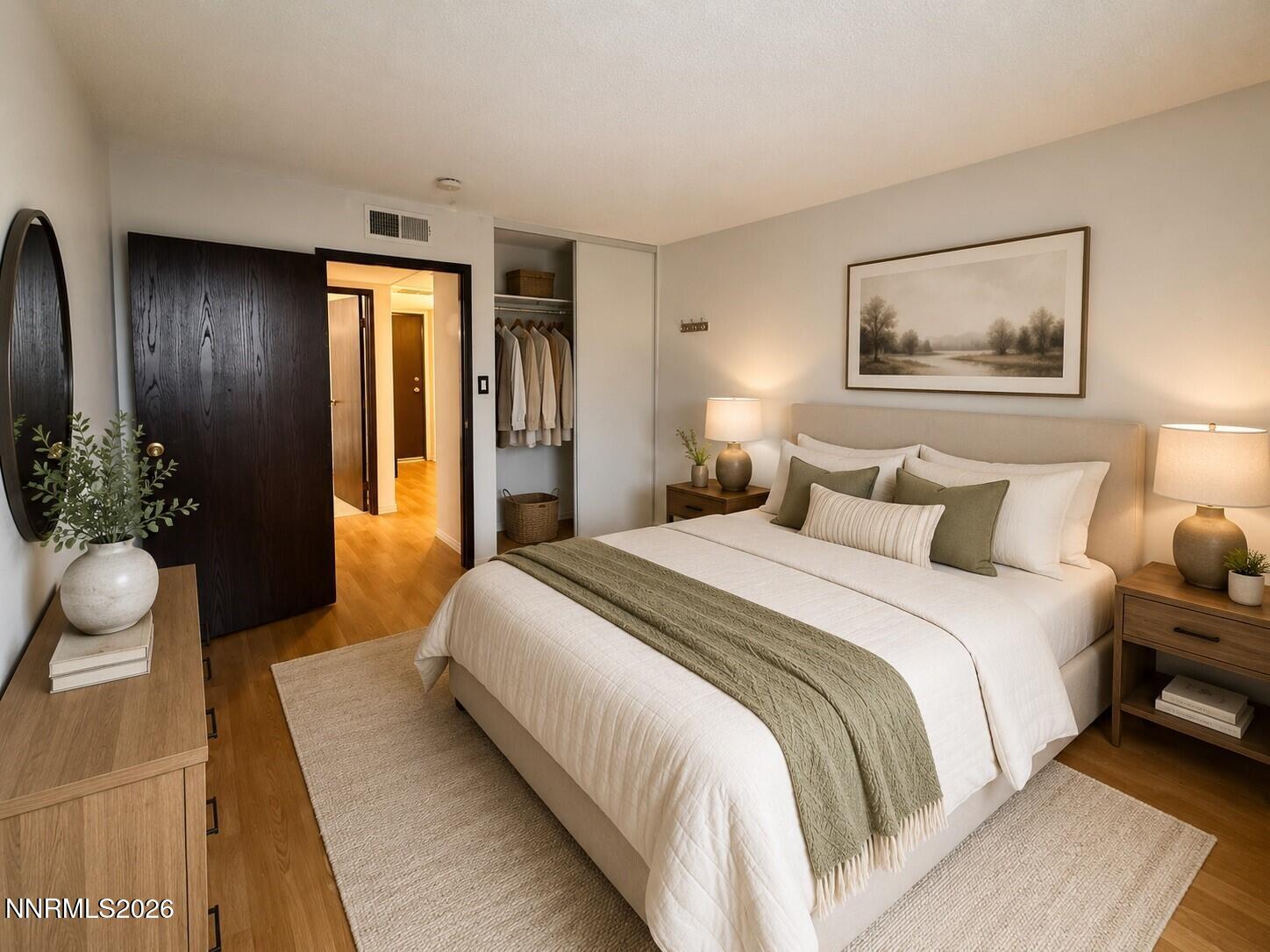 2955 Lakeside Drive, Unit 120 Reno, NV 89509 - Photo 4 of 21 a bedroom with bed and a potted plant