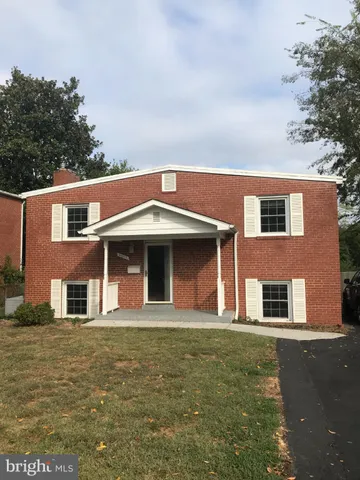 a front view of a house with glass windows