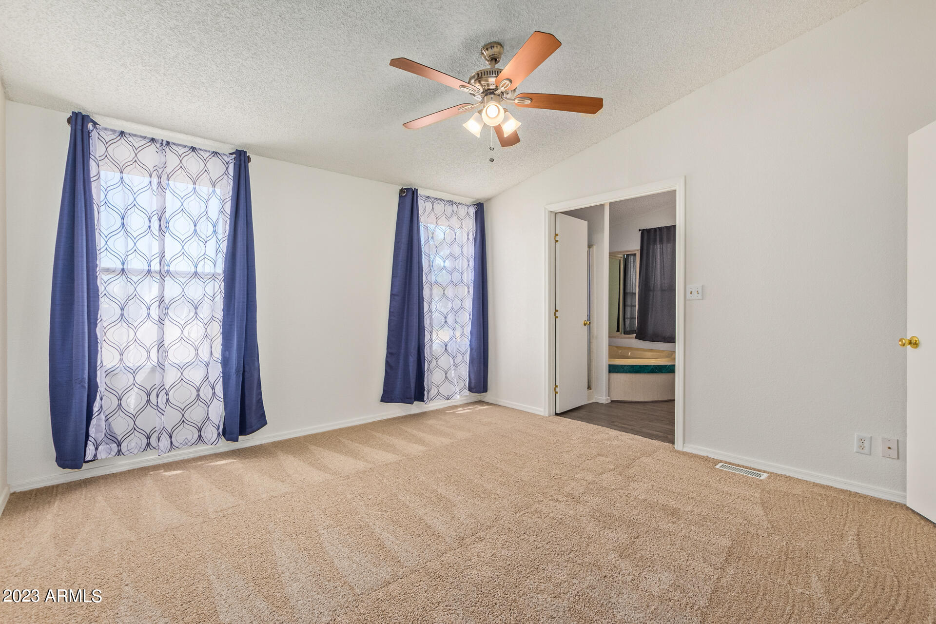 4958 East Rolling Ridge Road San Tan Valley, AZ 85140 - Photo 12 of 41 Spacious primary bedroom