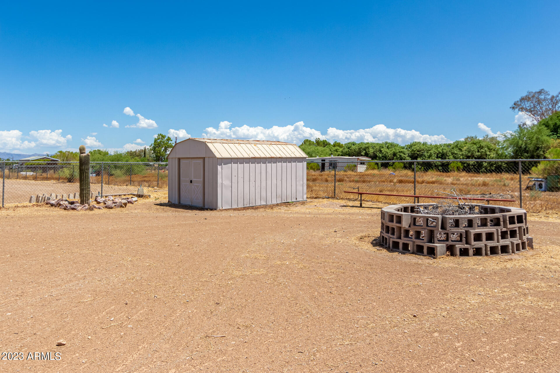 4958 East Rolling Ridge Road San Tan Valley, AZ 85140 - Photo 24 of 41 Metal storage and firepit