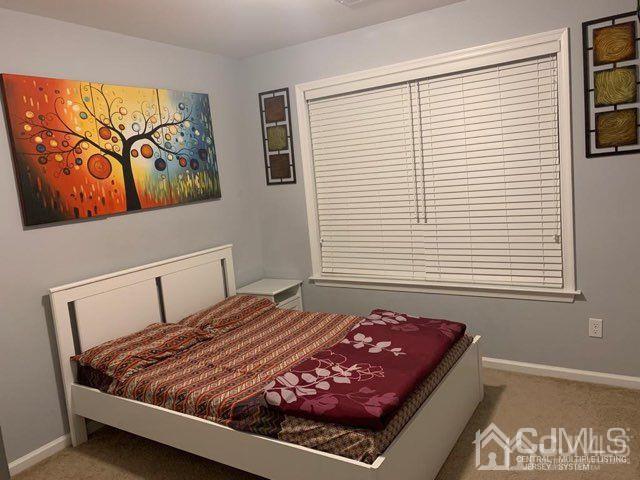 58 Christopher Street Carteret, NJ 07008 - Photo 12 of 20 a bedroom with a bed and wall painting