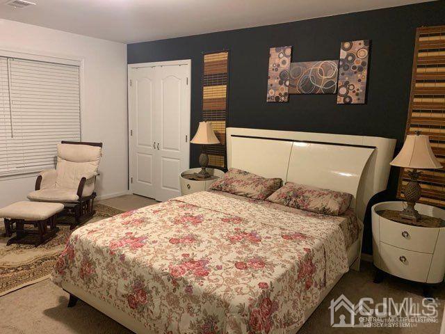 58 Christopher Street Carteret, NJ 07008 - Photo 16 of 20 a bedroom with a bed and wall painting