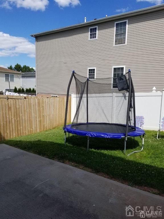 58 Christopher Street Carteret, NJ 07008 - Photo 19 of 20 a front view of house with yard and green space