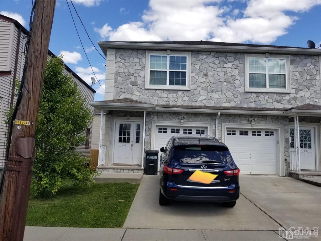 58 Christopher Street Carteret, NJ 07008 - Photo 2 of 20 a car parked in front of a house